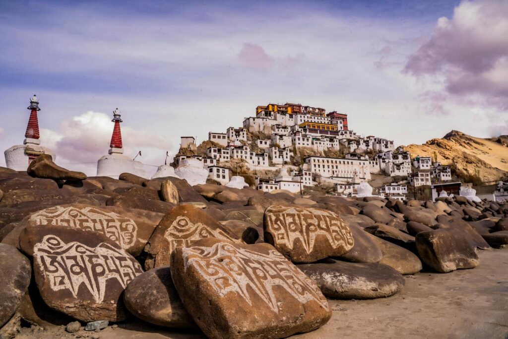 a beautiful building near a rocky shore