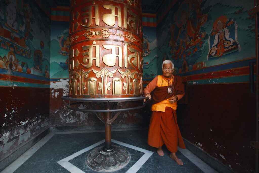 old monk in a temple in ladakh